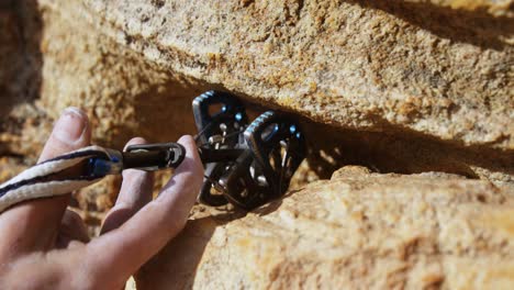 mountaineer trying to adjust the climbing equipment 4k