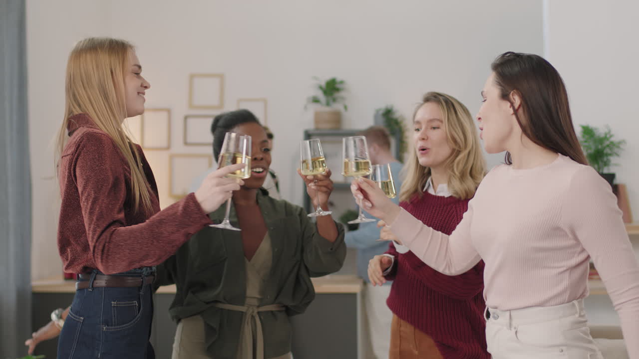 Slowmo of Happy Women Toasting and Dancing