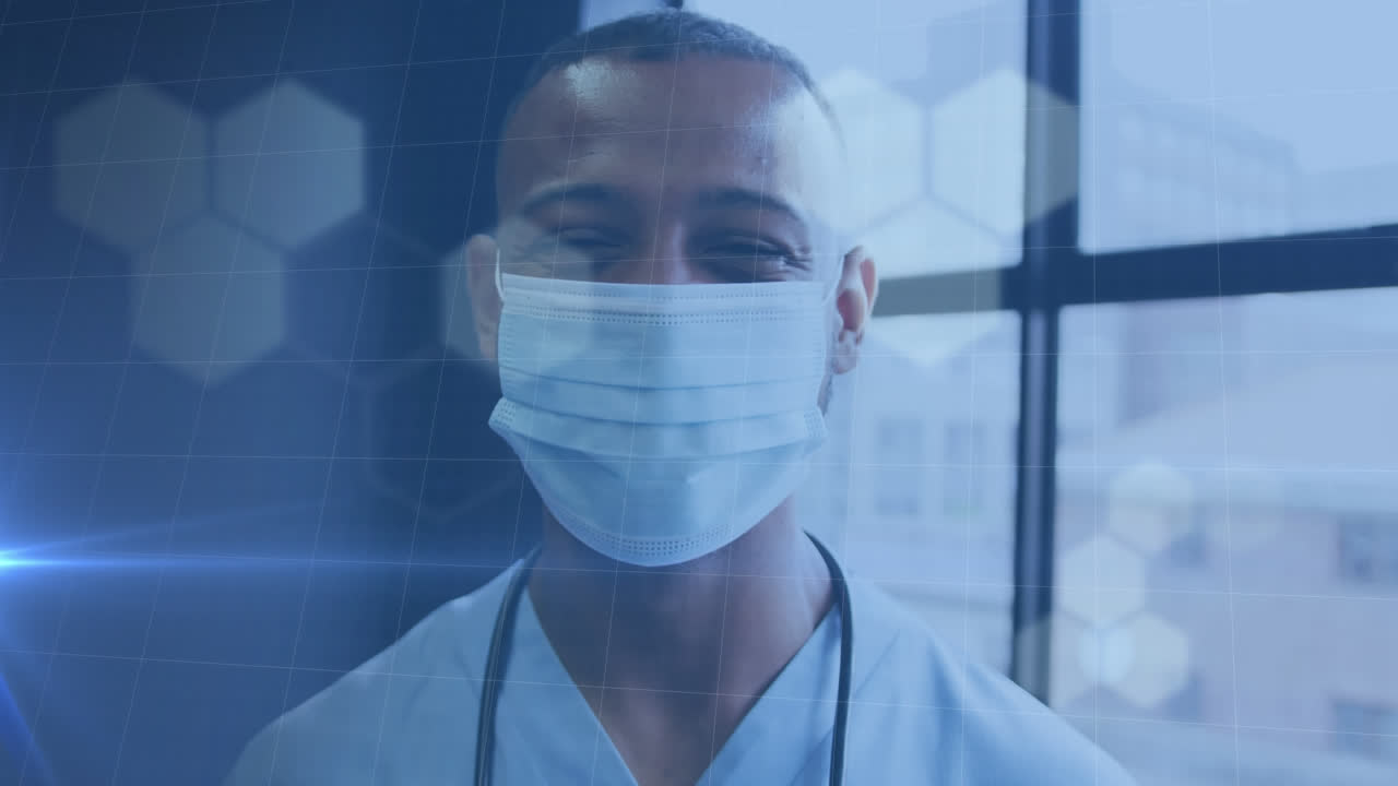 Animazione di punti luce su un medico afroamericano che indossa una mascherina.