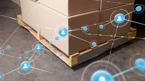 network of profile icons against multiple delivery boxes on a palette at warehouse