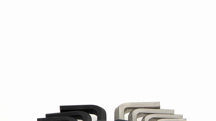 Groups of silver and black alanwrenches rest in a metal case