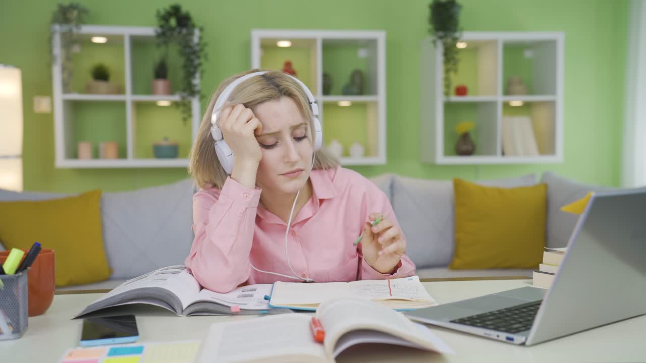 University student girl studying at home bored and thoughtful.