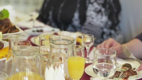 people celebrate holidays at festive dinner. table served with lula kebabs