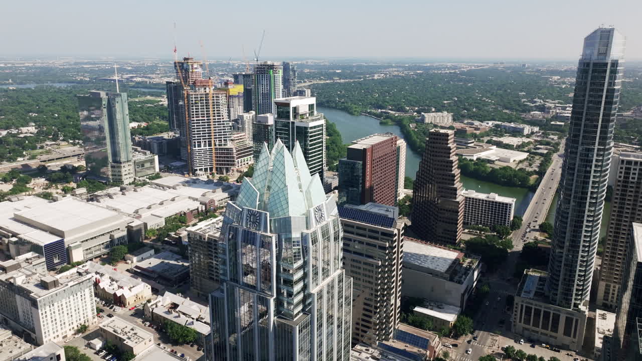 Aerial view of downtown Austin, Texas skyline featuring the Frost Bank Tower and Lady Bird Lake