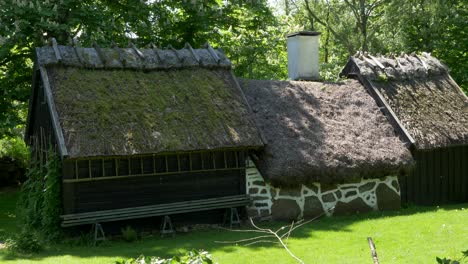 traditional cottage built on the slope with open cultivation and grazing land