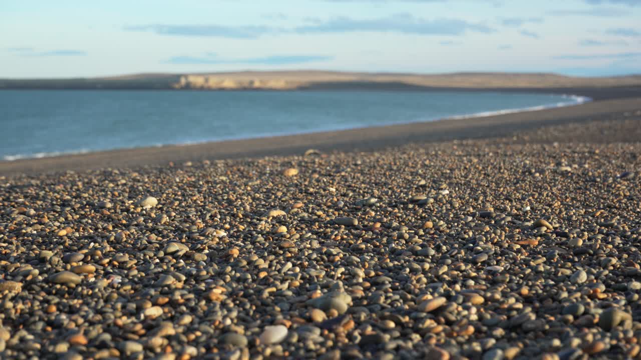 Close-up view of pebbles with selective focus along the shore of the Atlantic Ocean in southern Argentina.