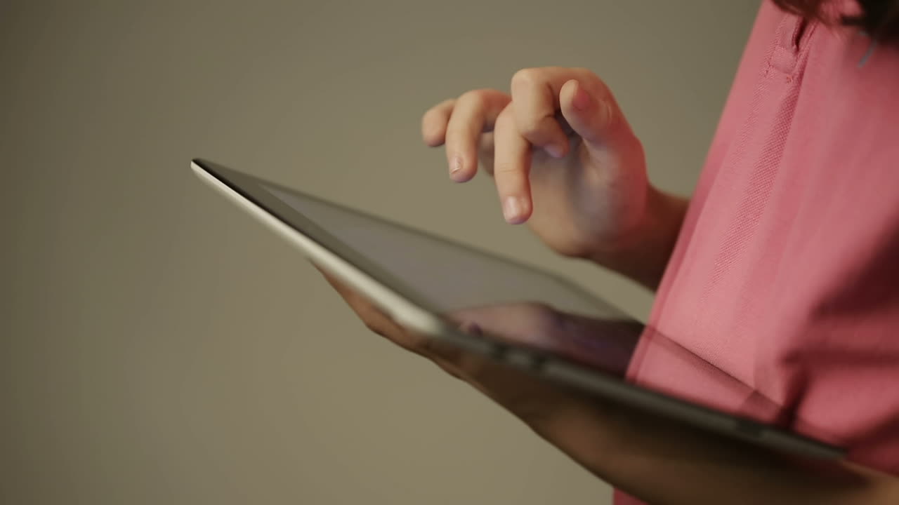 Girl hand touching screen on tablet pc. Teen girl hand touching screen on modern digital tablet pc