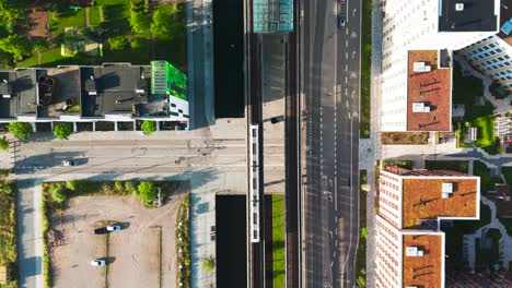 aerial view of modern city with canal and train