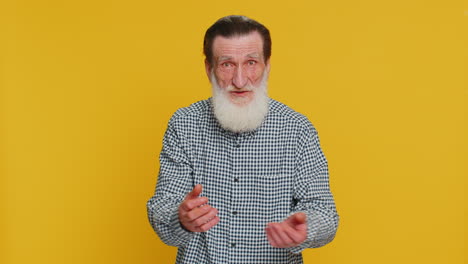 senior man show a little bit gesture begging help need some more please give me measuring small size