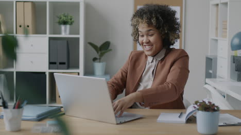 woman working on laptop in office