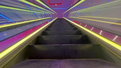 colorful lights on ascending escalator