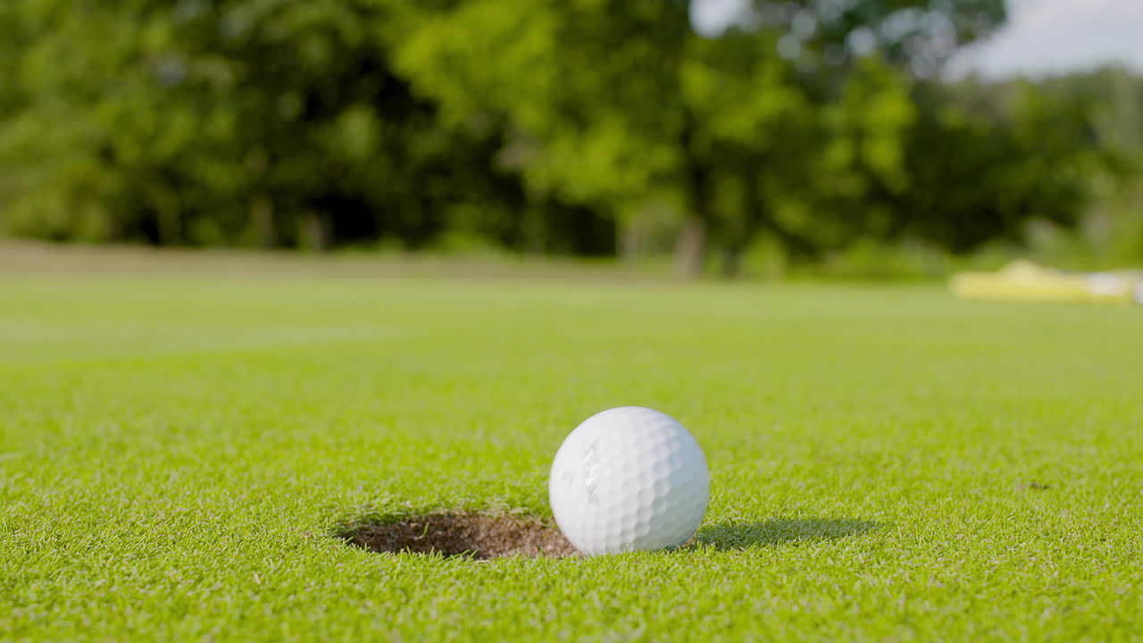 Golf Ball Falling into Hole