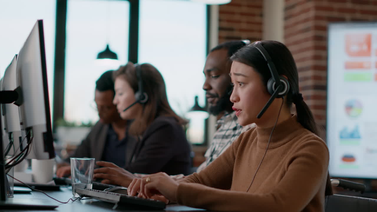 Female employee wearing headset and microphone at work