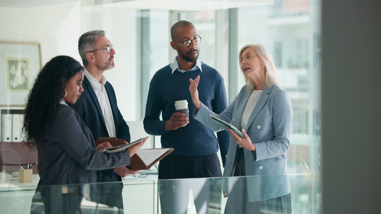 Diverse Group of Business People Discussing Work in Office