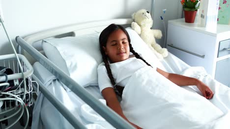 sick girl resting on bed