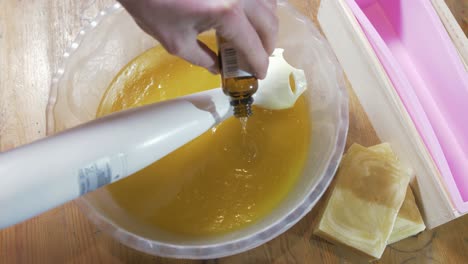 mixing essential oil into the cold process soap process