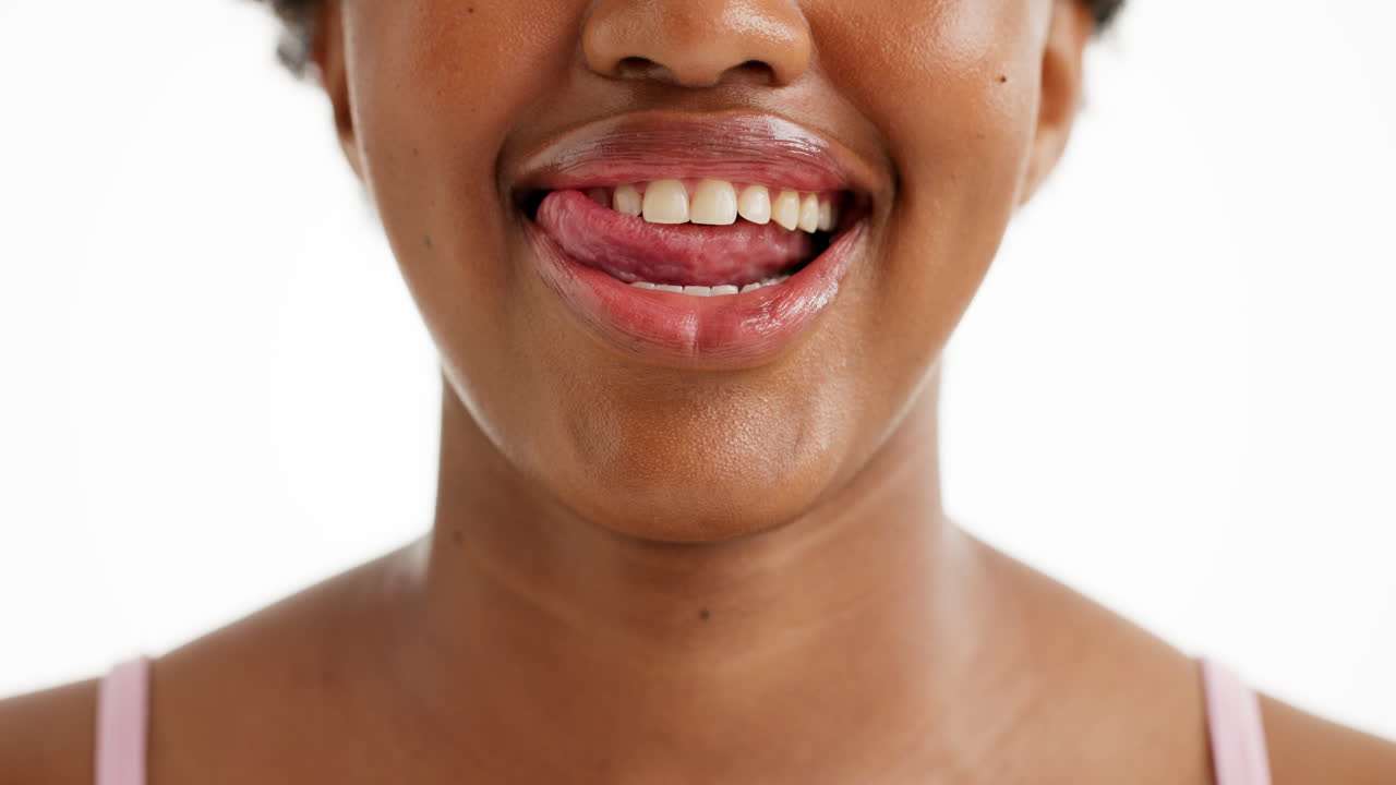 Close-up of a Woman's Mouth with Tongue Out