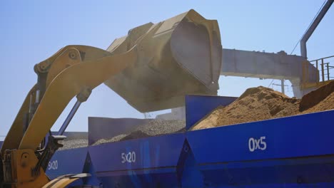 equipment for production of asphalt. asphalt mixing plant pouring asphalt in to truck in factory industrial