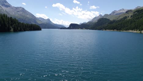 Aerial-Flying-Over-Calm-Lake-Sils-In-Silsersee,-Switzerland