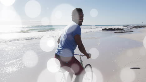 riding bicycle on beach, man with bright animation bokeh light effects