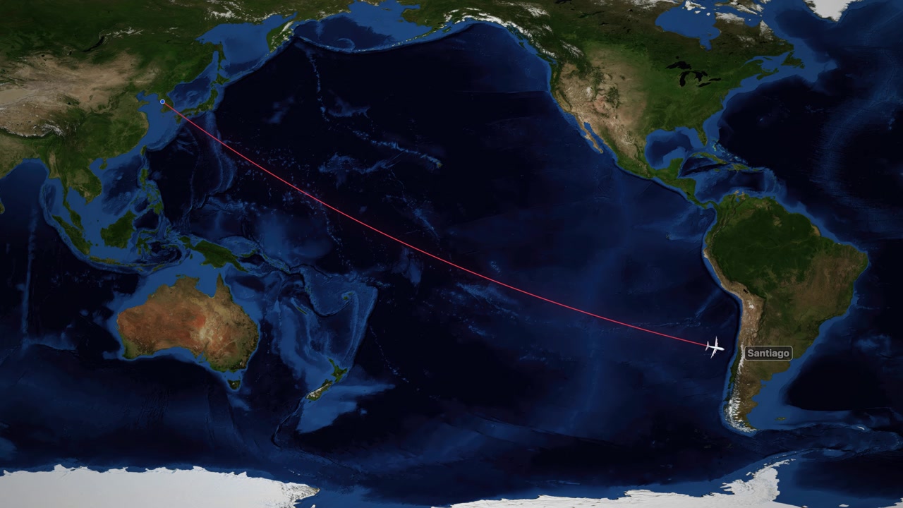 Satellite map animation tracks an airplane flying from Seoul to Santiago across the Pacific