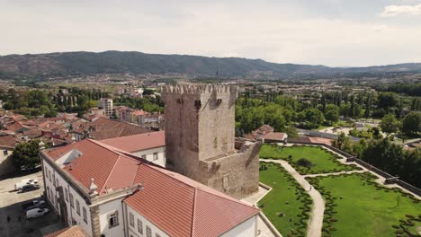 Orbital-shot-of-castle-tower,-museum-and-garden-in-Chaves,-Portugal