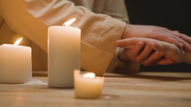 Close Up Shot Of Man Wearing Robes Representing Figure Of Jesus Christ Holding Persons Hand