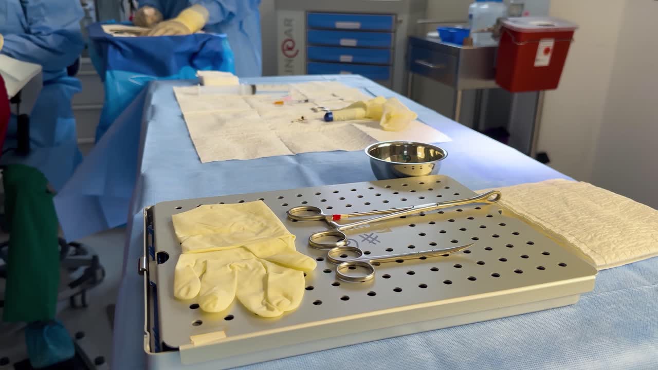 An operating table set up for ophthalmological surgery, equipped with surgical instruments