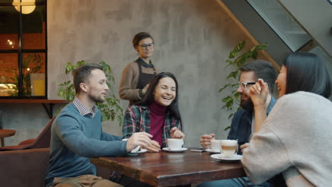 Friends enjoying coffee in a cozy cafe