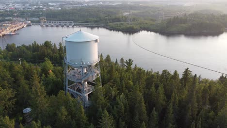 water tower in small city, reveal dam