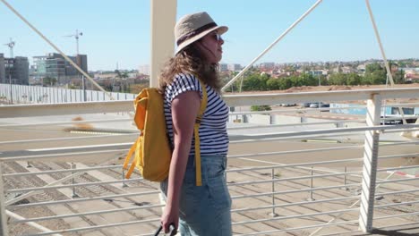 female traveler walking on airport jet bridge before boarding
