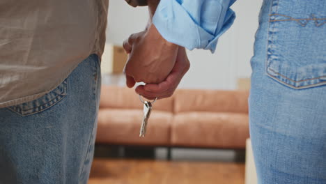 couple holding keys to their new home