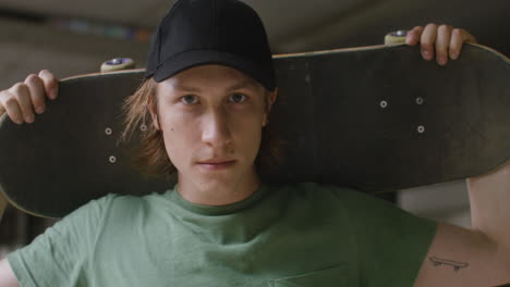 caucasian skateboarder in a ruined building.