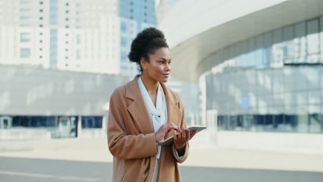 businesswoman using tablet in the city