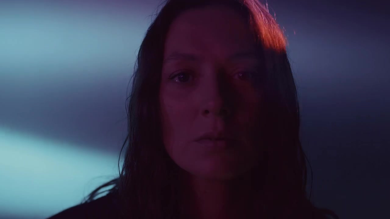 Studio Portrait of Tearful Sad Woman in Moody Multicolored Light