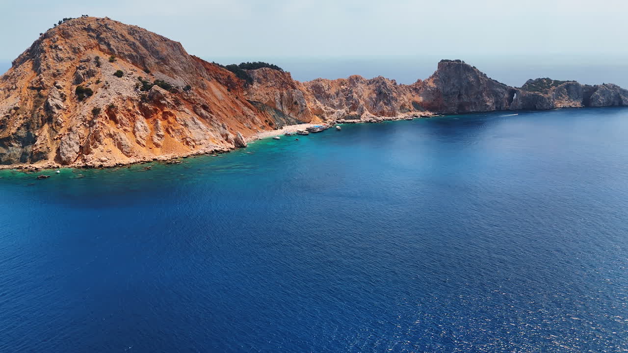 Cliffs by turquoise waters. Stunning coastal cliffs meet clear seas under a bright sky, perfect for exploration
