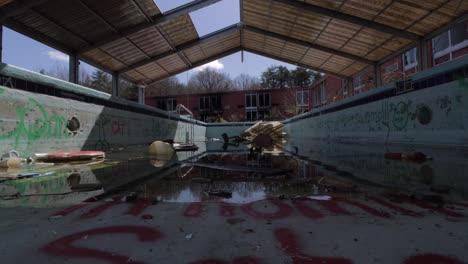 footage of an abandoned covered swimming pool