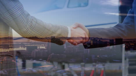 digital composition of business people shaking hands over airport against cityscape in background