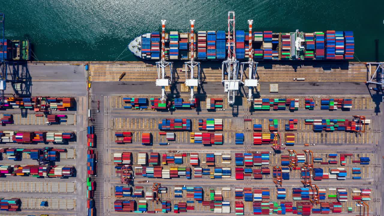 4k, Time lapse, Aerial view container ship carrying container in import export business logistic and transportation of international by container ship in the open sea.