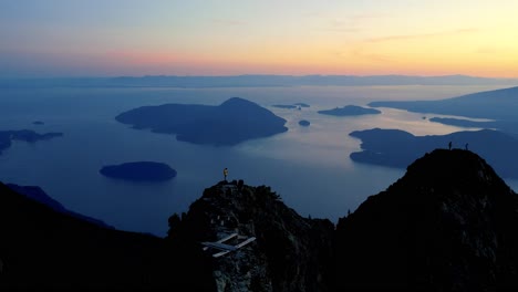 drone shot on top of a mountain with views of the pacific ocean