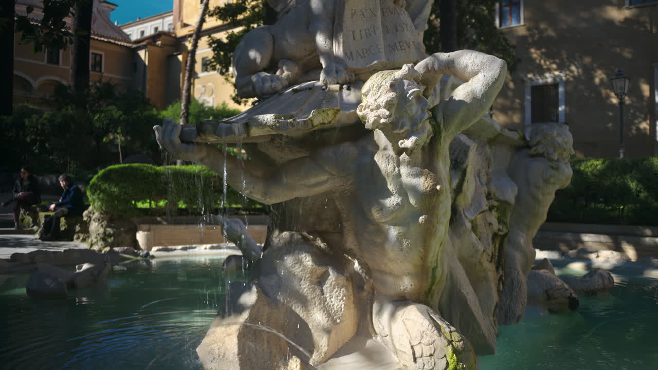 Water fountain in the garden of the Basilica di San Marco Evangelista al Campidoglio. Rome, Italy