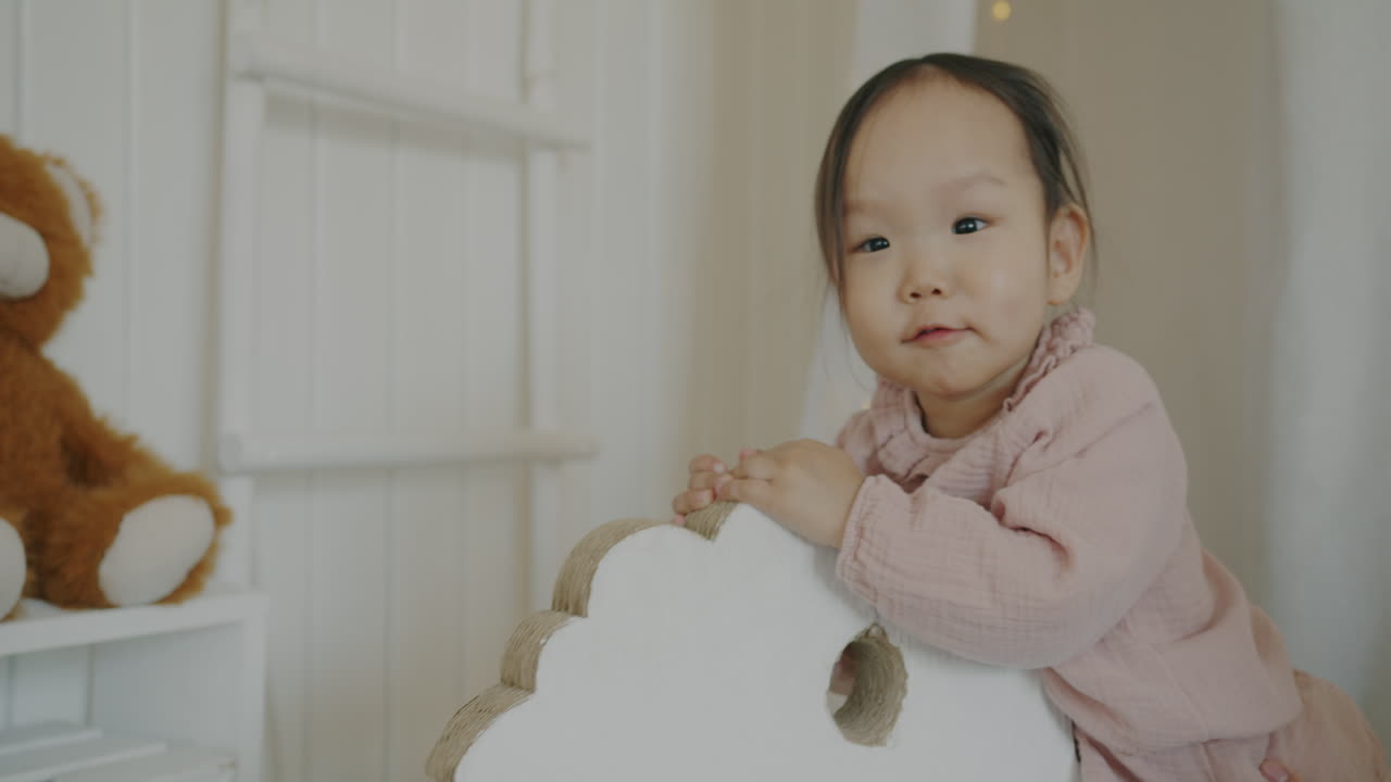 Baby Girl Playing on Wooden Horse
