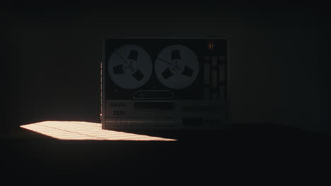 a vintage tape recorder in a red blinking light