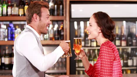 Smiling-couple-talking-and-toasting-together