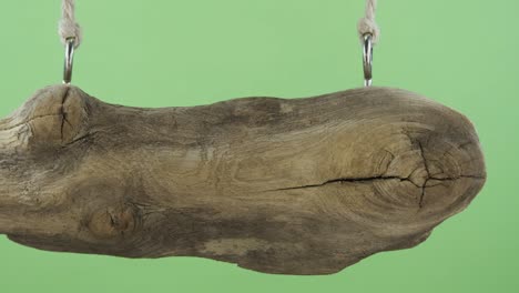 panorama, of a hanging wooden sign. isolated on green screen.