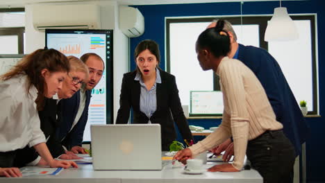 Happy-diverse-businesspeople-giving-high-five-during-team-corporate-brainstorm