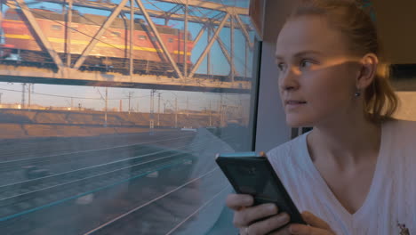 In-Saint-Petersburg-Russia-in-train-rides-young-girl-and-looking-out-the-window