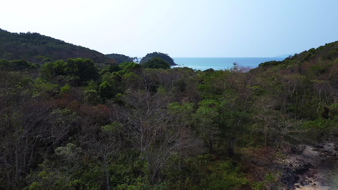 Koh Mak tropical island in Thailand showing turquoise water and green rainforest. Beautiful aerial view flight Unbelievable aerial view flight