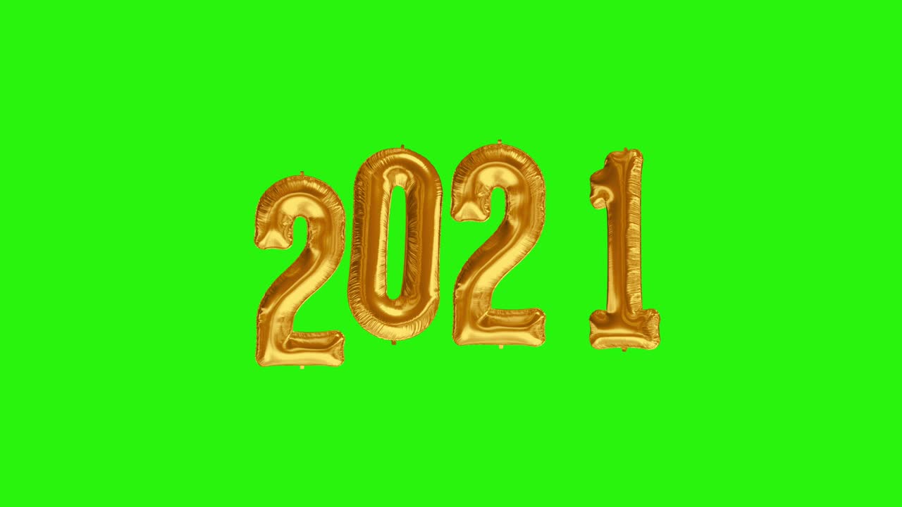 Neujahrsfeier 2021. Goldene Folienballons mit der Zahl 2021 auf grünem Hintergrund