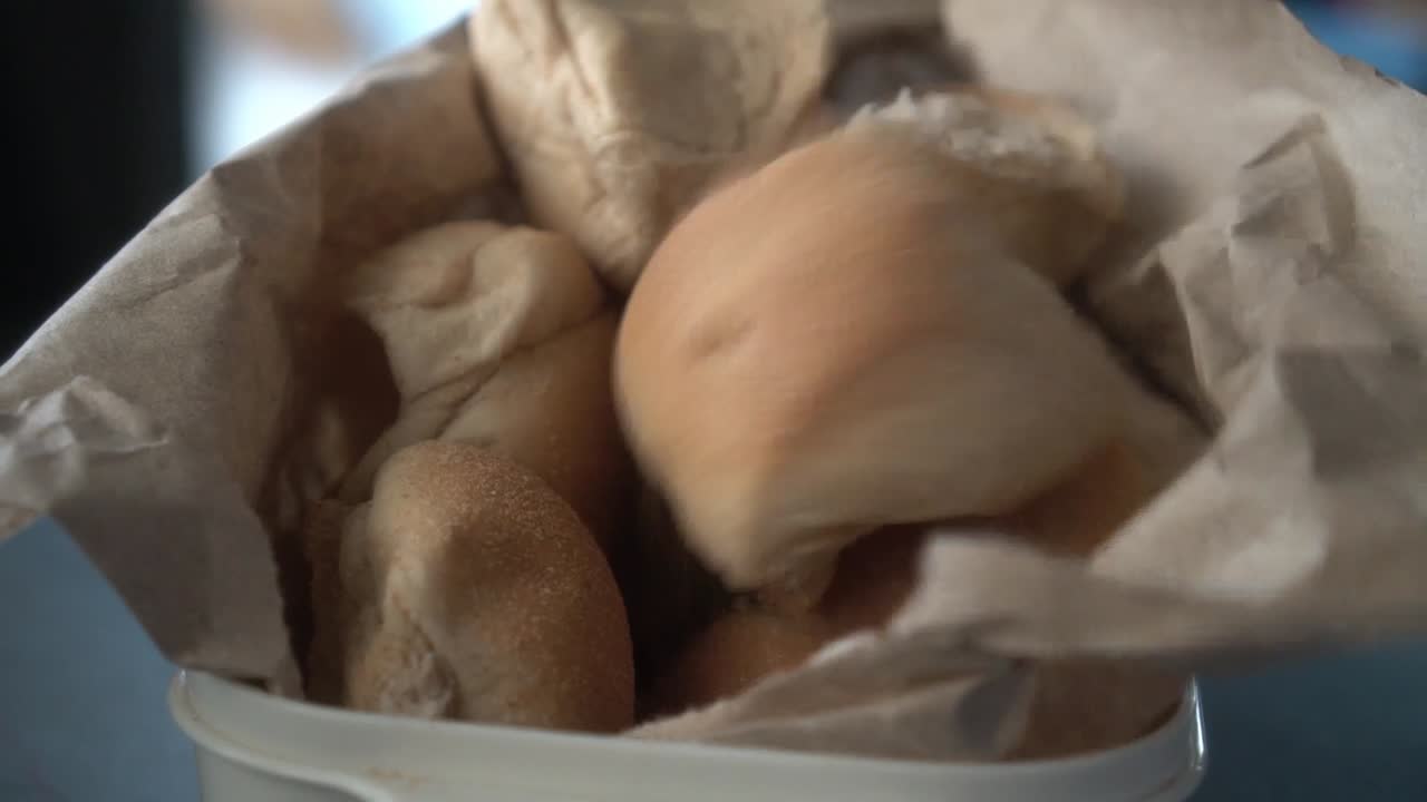 Pandesal is a popular Filipino bread roll, soft and slightly sweet, often enjoyed for breakfast. It's typically dusted with fine breadcrumbs, golden brown on the outside, and fluffy inside.